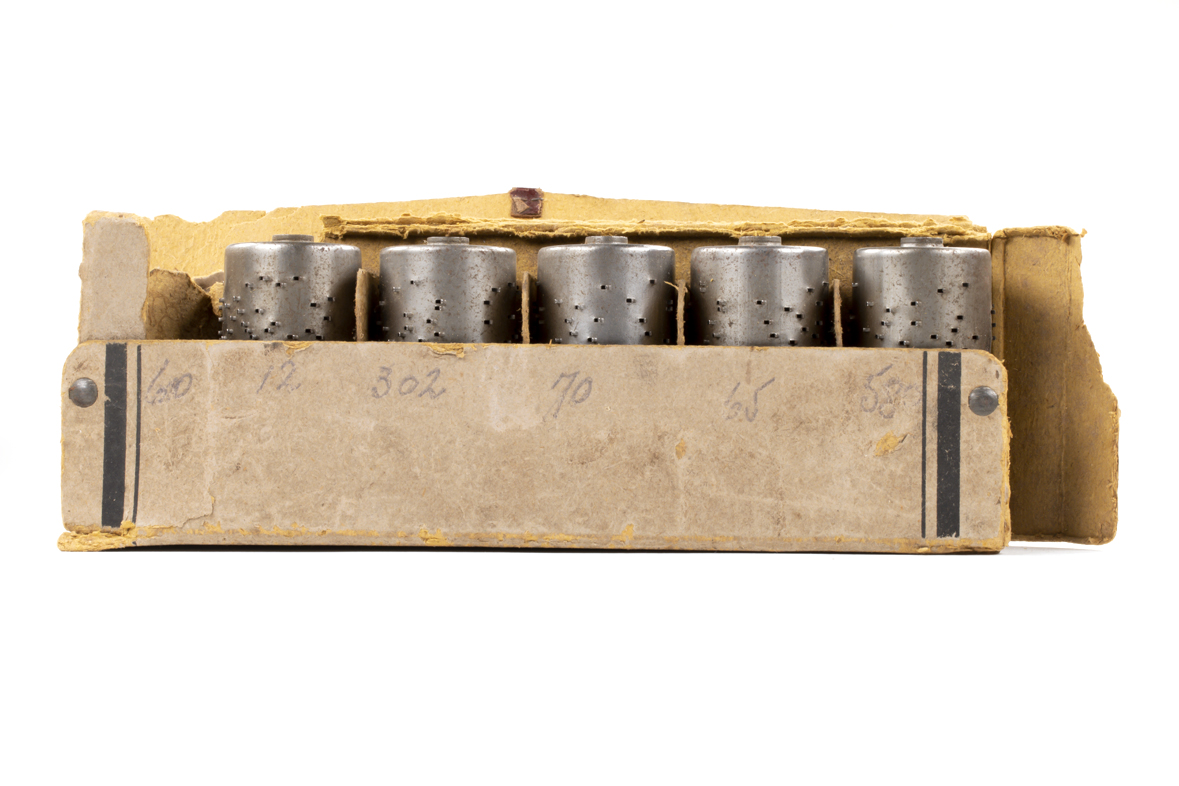 Cardboard box of five small cylinders for Junhans Musical Clock
