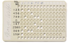 Plastic card punched with holes to store a phone number for the automatic Card Dialer telephone