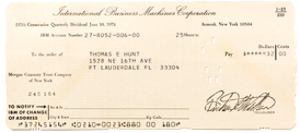 An IBM stock dividend check with information like value and address both punched and typed by computer