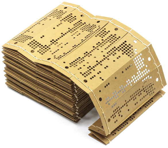 A stack of heavy cardboard cards punched with holes in rows and strung together with string