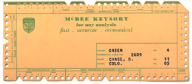 Stack of heavy card stock cards with notches on edges and information typed on interior